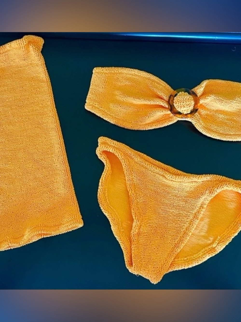 HUNZA G  set of Flora crinkled bikini and its matching skirt .
